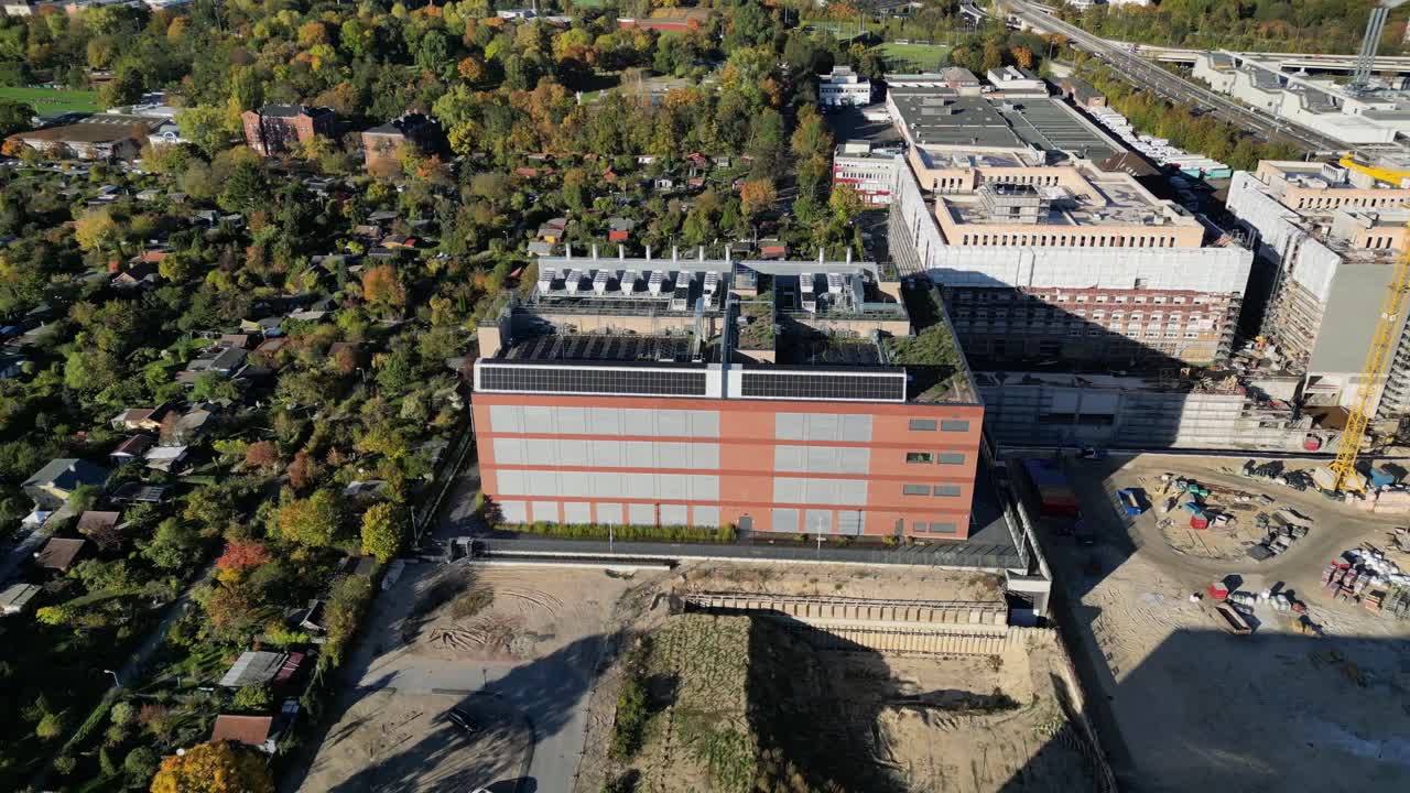 biggest data center building providing cloud computing services in an urban city. blockchain digital database, internet security for sensitive data. Perfect aerial view flight panorama orbit drone