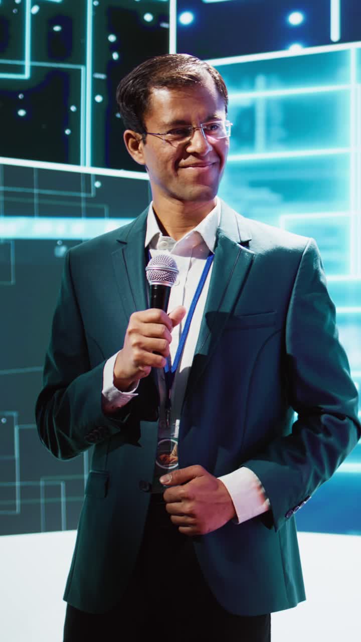 Vertical video Presenter and guest talking at AI summit exploring latest tech developments