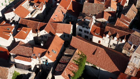 red rooftops at croatian town of trogir in summer - aerial drone shot