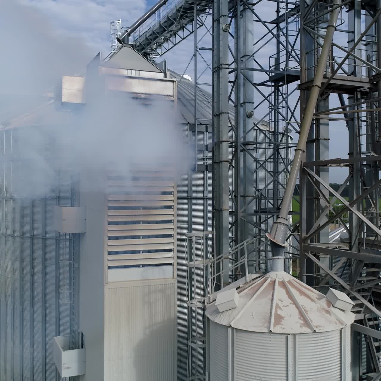 Big factory metal constructions. Huge industrial metal containers. Aerial view