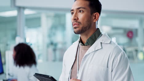 scientist reviewing data on a tablet in a modern laboratory setting