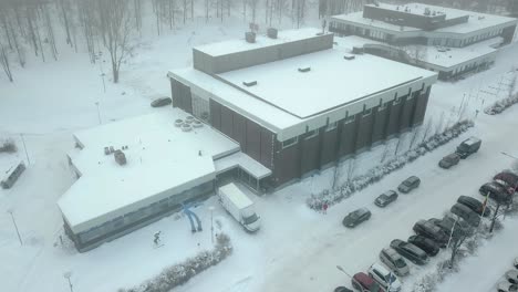 winterwonderland aerial footage with snow covered houses and parks