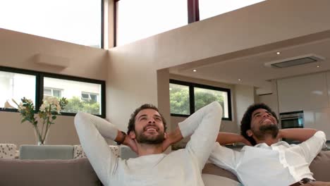 Gay-couple-relaxing-on-the-couch