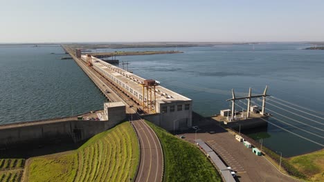 An-aerial-image-capturing-the-immense-scale-and-size-of-the-Yacyretá-hydroelectric-power-plant,-emphasizing-its-impressive-magnitude-and-importance-for-regional-energy-production