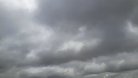 Mid-afternoon-thunderstorm-rain-clouds-forming-and-blending-across-the-african-horizon-time-lapse,-noise-free-4k-footage