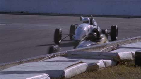 formula cars compete on a circuit track 4