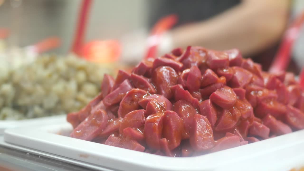 Pink Sausages Displayed at a Food Stall