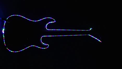 horizontal electric guitar shape with multicolored led's changing