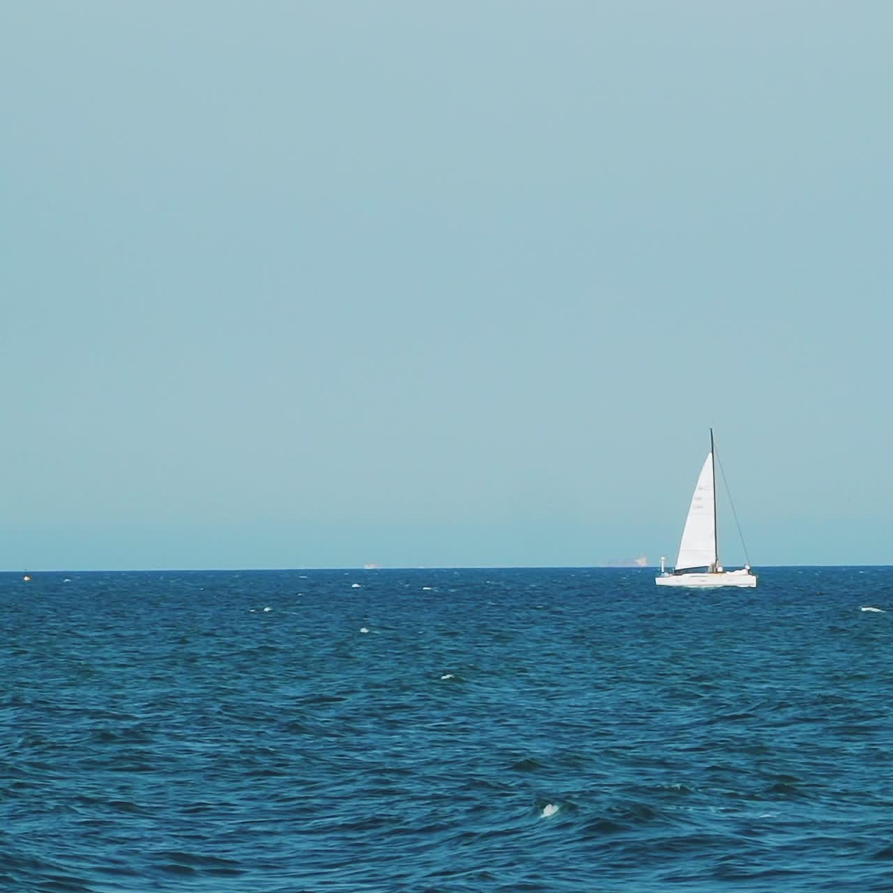 Yacht sailing on open sea at sunny day. Luxury yacht cruising at sea. Full open sails