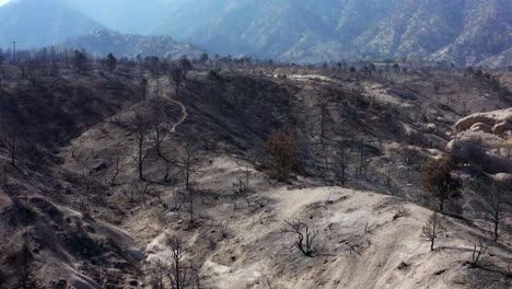 Mountain-landscape-ravaged-by-Southern-California's-wildfires---smoke-and-hazy-aerial-view-of-the-destruction