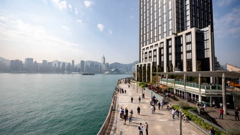 hong kong - 19 march 2025 : timelapse in the harbour waterfront in kowloon, hong kong