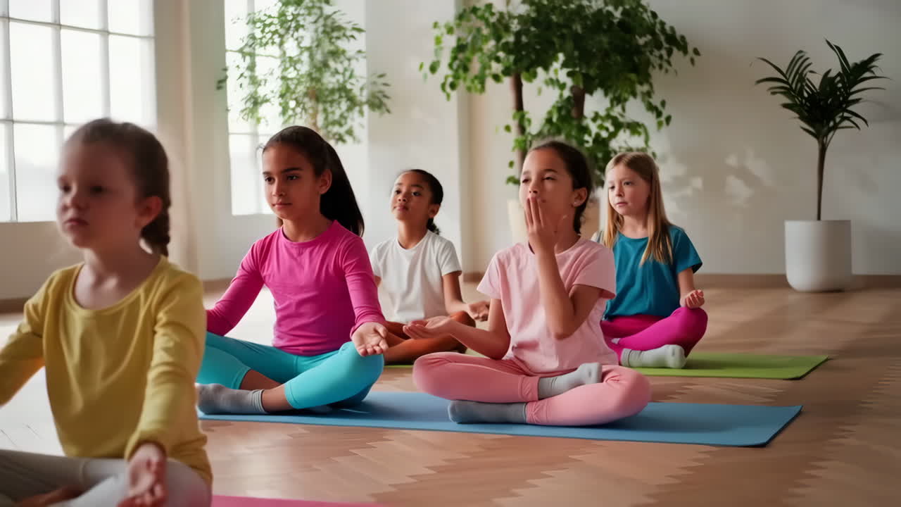 Young Girls Practicing Yoga and Meditation Together Indoors