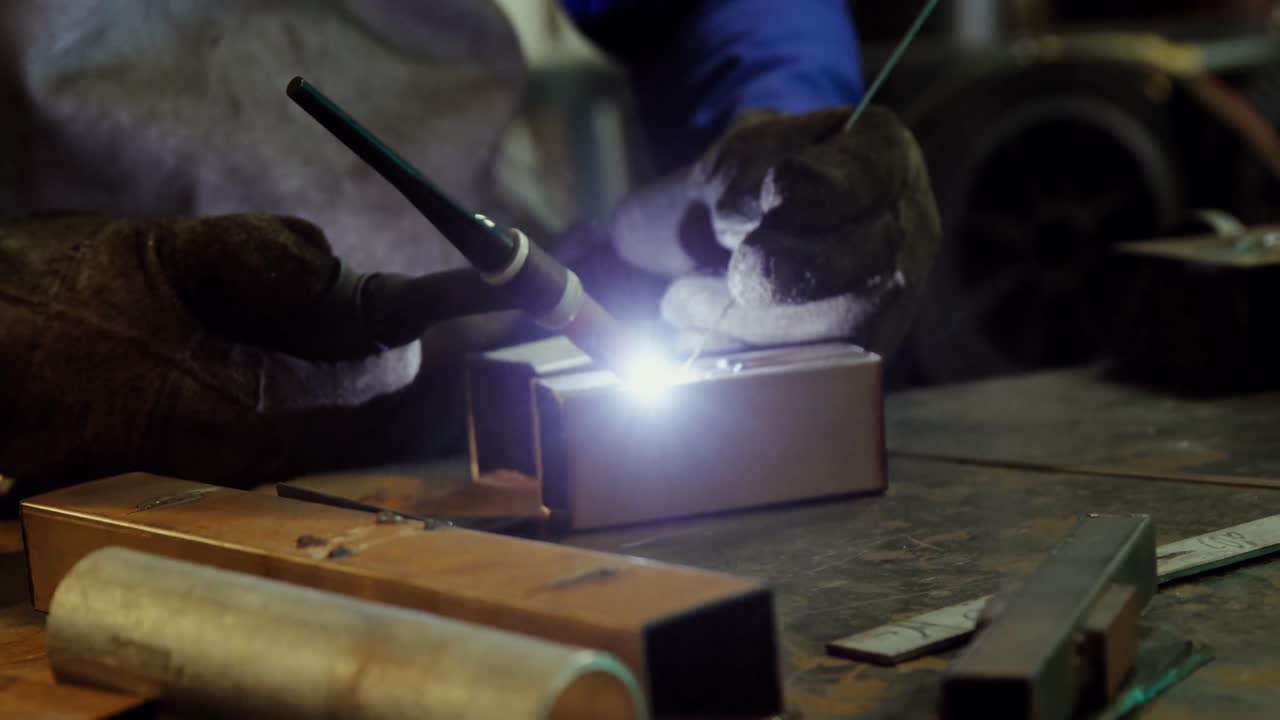 Male welder working on a piece of metal