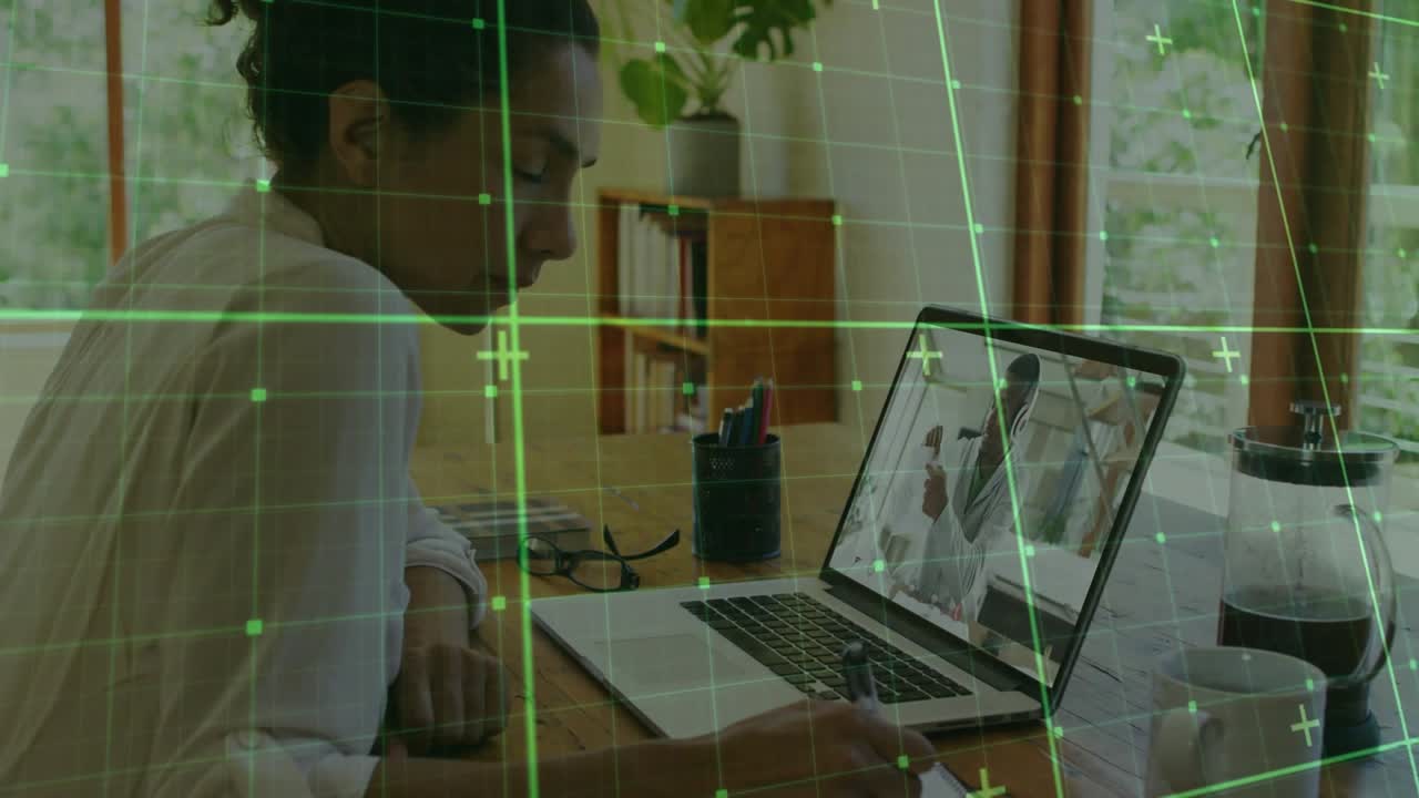 Woman initiating laptop call discussing business project while noting peer gesturing, grid overlay