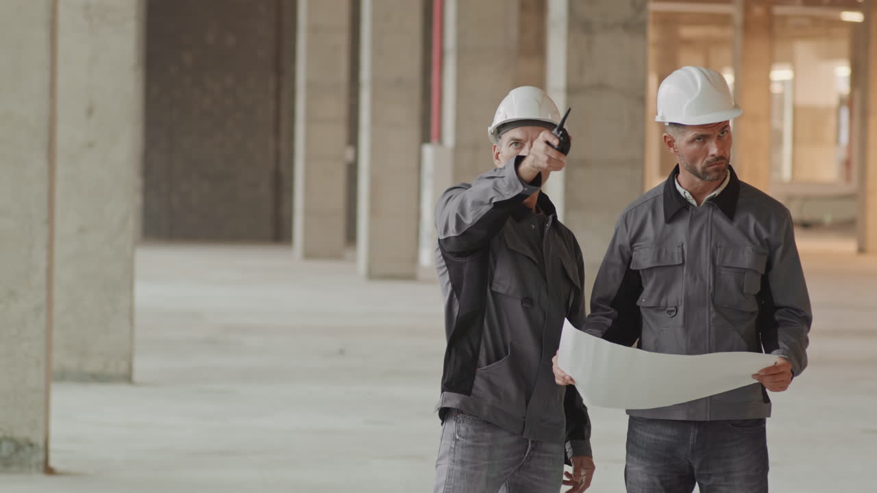 Foreman Explaining Project Plan to Worker