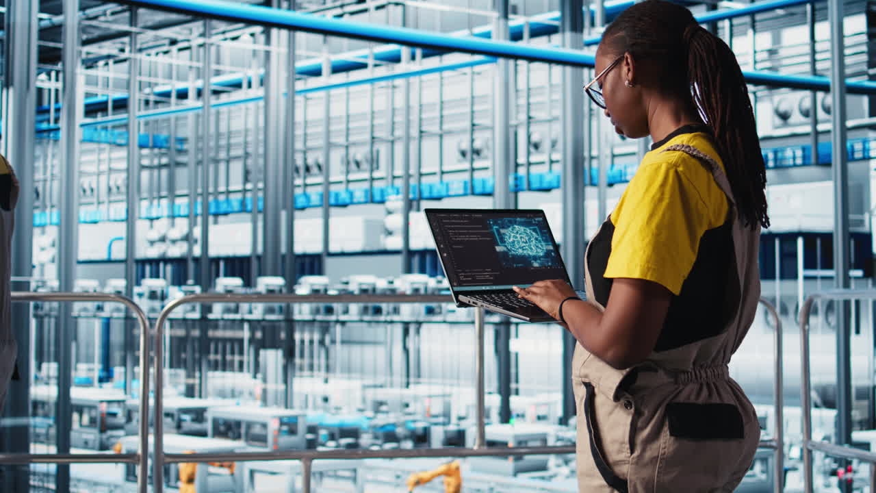 Industry 4.0 industrial plant engineer controlling automated machinery using AI