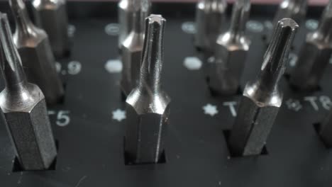 Tools bit set for repair of smartphones and computer equipment close-up.