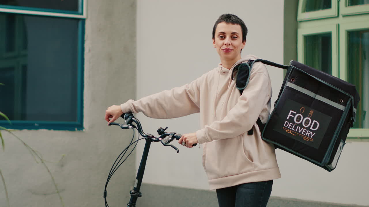 Young Woman Food Courier on Bicycle