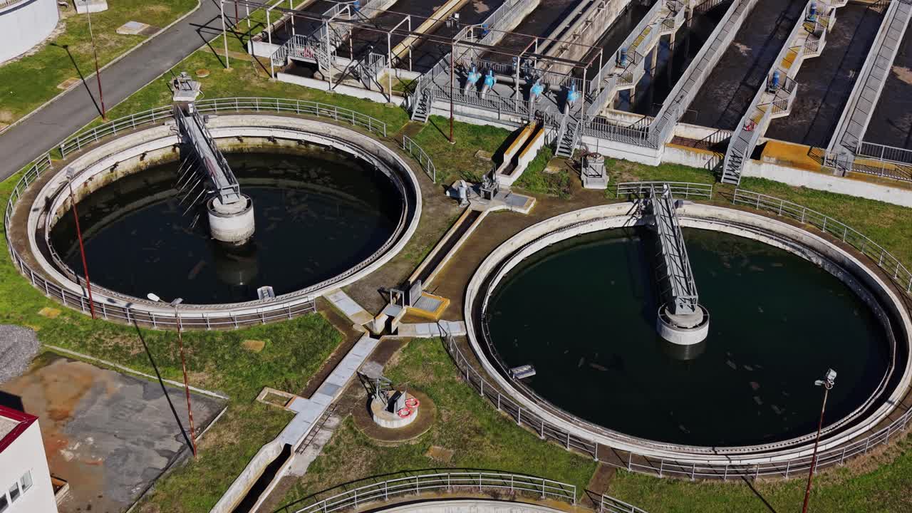 Water treatment facility with multiple circular tanks and machinery