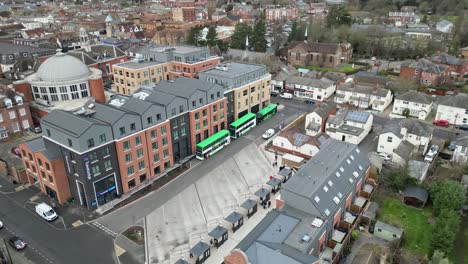 Three-Busses-waiting-at-stand-Braintree-Essex-UK-Drone,-Aerial,-view-from-air,-birds-eye-view,-footage