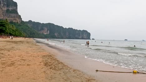 people enjoying the beach and sea in krabi