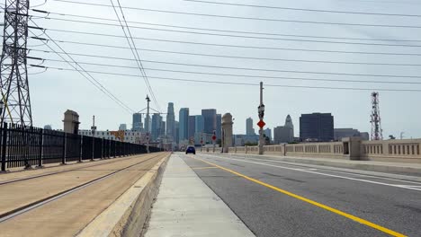 cars driving on 1st street bridge heading to downtown los angeles, usa