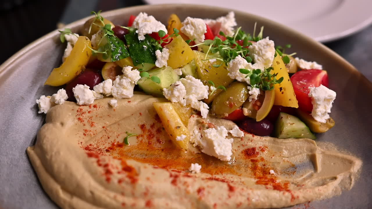Humus plate with white cheese and vegetables