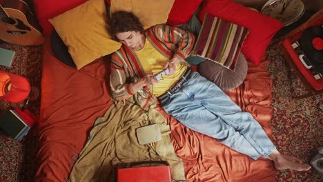 man gaming in a retro bedroom