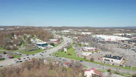 4K-Aerial-Drone-footage-of-industrial-shopping-centers-and-strip-malls-in-Middletown-New-York-and-traffics-can-be-seen-with-mountains-in-the-background