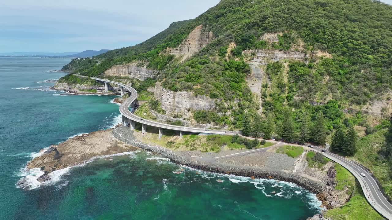 Wide angle view of the iconic Sea Cliff Bridge with panoramic ocean and cliff views