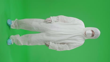 medical personnel in protective suit on green screen