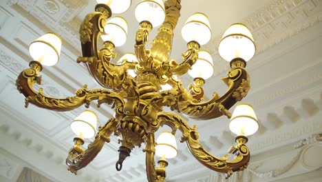 ornate gold chandelier in historic building