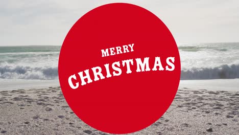 Animation-of-merry-christmas-text-over-caucasian-family-at-beach