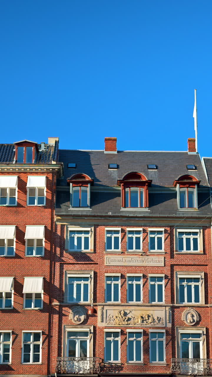 View of the buildings on the streets of Nyhavn. Vertical, Copenhagen, Denmark