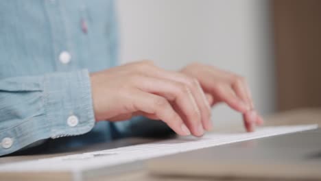 close up hand of a business woman typing keyboard desktop computer on desk office