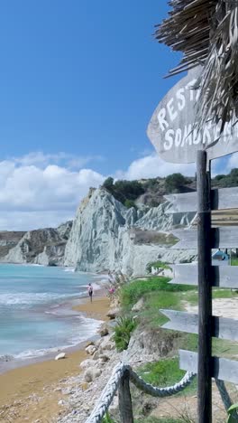 beautiful coastal scenery with people relaxing on the beach