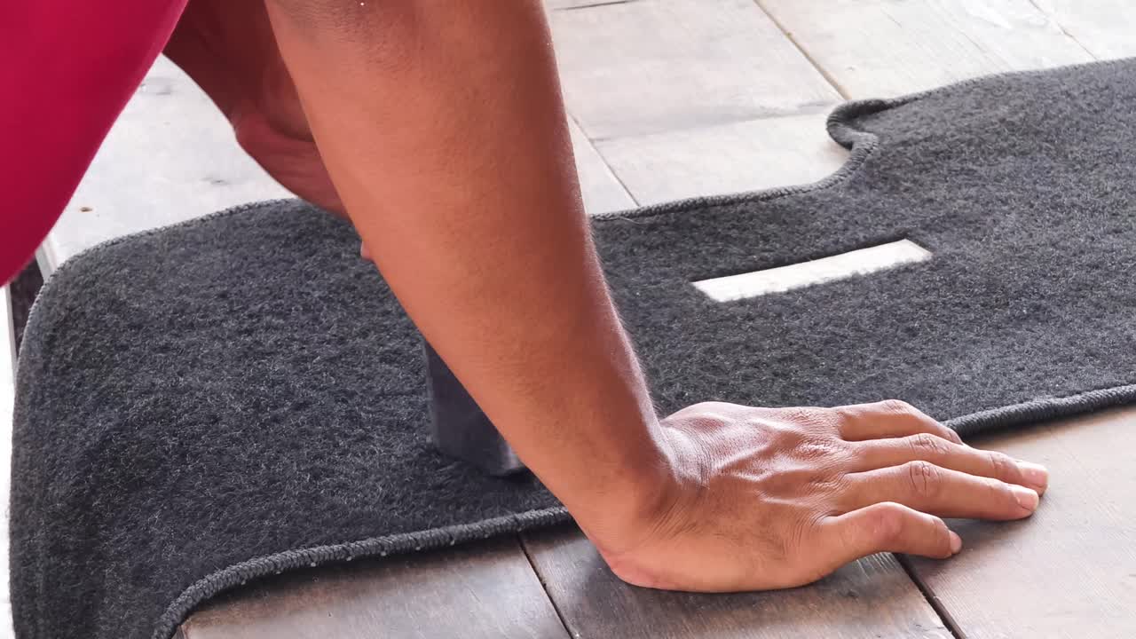 Cleaning a Car Floor Mat with Vacuum