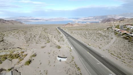 Lake-Mead-wide-shot-and-Highway-93-near-Boulder-City,-Nevada-and-drone-video-moving-up