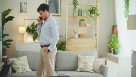 Man-Walks-and-Talks-on-Phone-with-Customer