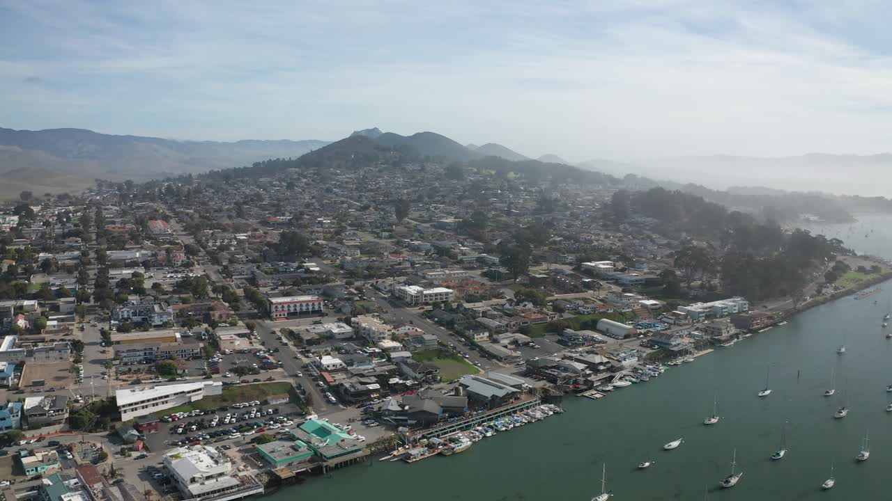 Wide aerial panning shot of Morro Bay, California. 4K
