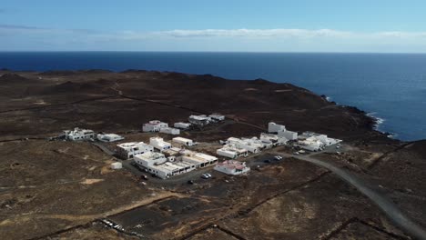 aerial shot small coastal town in lanzarote with view of atlantic ocean