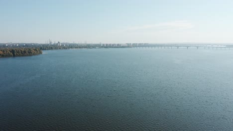 aerial view of a large overflowed beautiful river. long bridge over the river