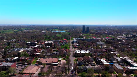 denver cityscape rocky mountain landscape spring summer city park washington park aerial drone colorado street tall buildings front range lodo downtown cars sunny blue sky forward motion