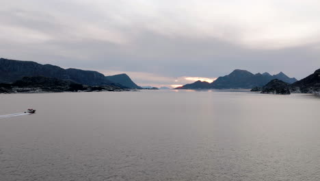 motorboat, tourists drive through lofoten to view a famous fjord