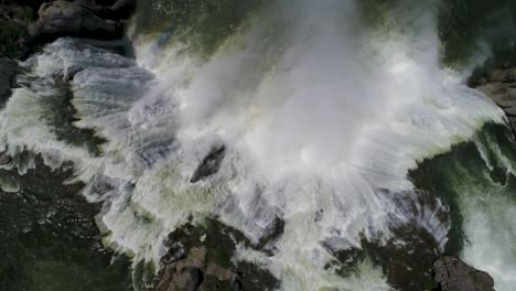 A-4K-drone-shot-of-Shoshone-Falls,-a-raging-waterfall,-which-often-reflects-rainbows,-located-along-the-Snake-River,-only-3-miles-away-from-Perrine-Bridge-and-Twin-Falls,-Idaho