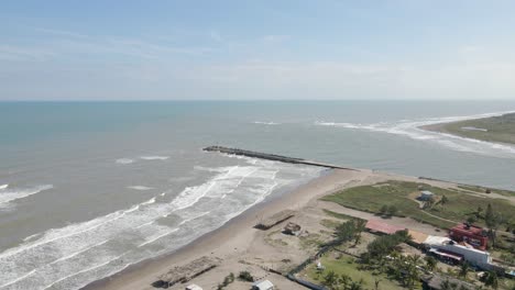 Outlet-of-the-tecolutla-river-to-the-sea,-aerial-view-of-the-beach-town-of-tecolutla-in-Veracruz,-Mexico