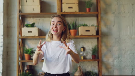 Young Woman Smiling at Camera in Home Office