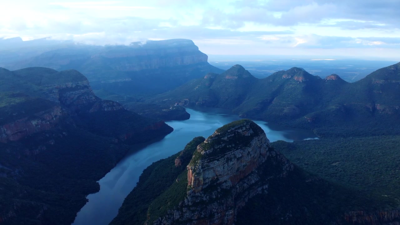 Aerial Canyon River Panorama At Dawn Showcasing Rugged Cliffs, Winding Turquoise Water, Rising Mist Over Dense . Media