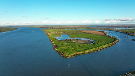 Aerial-view-of-Sherman-island-green-pastures-along-the-Sacramento-San-Joaquin-Delta-river,-Northern-California