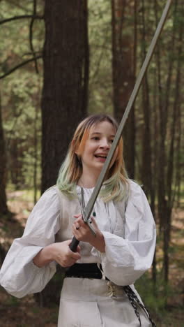 children in medieval attire train to fight with swords, historical fencing